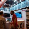 Vicente Burchard (IEGD) atiende a los visitantes del stand en la  Feria de Madrid por la Ciencia y la Innovación 